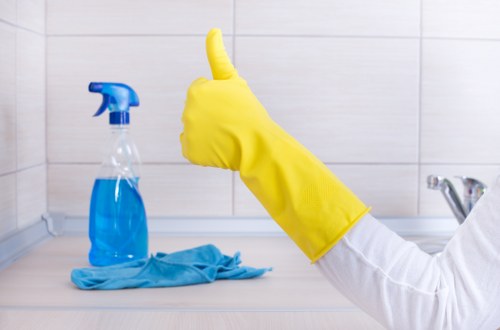 Cleaning technician reviewing liability and service conditions